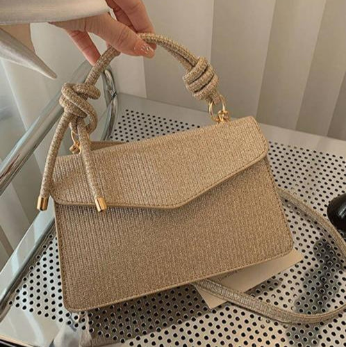 Cartera Brillante Color Dorado Con Nudos